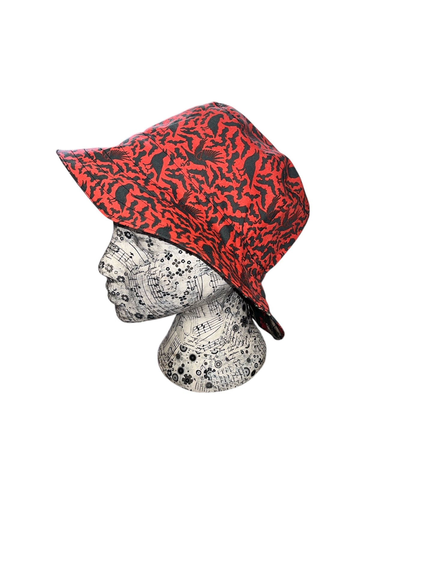 Reversible skull and rose/ crow and bat bucket hat