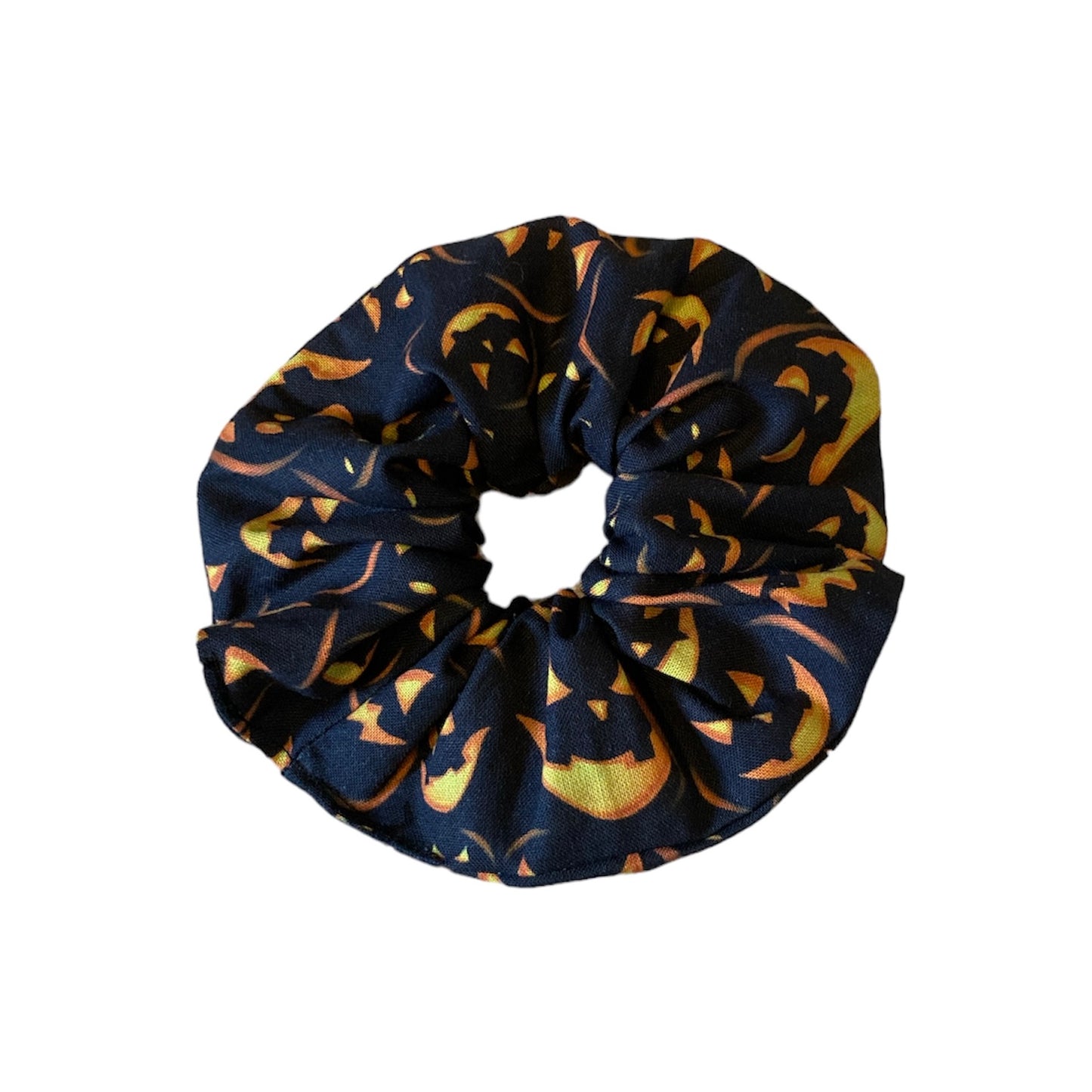 Spooky pumpkin on black scrunchie