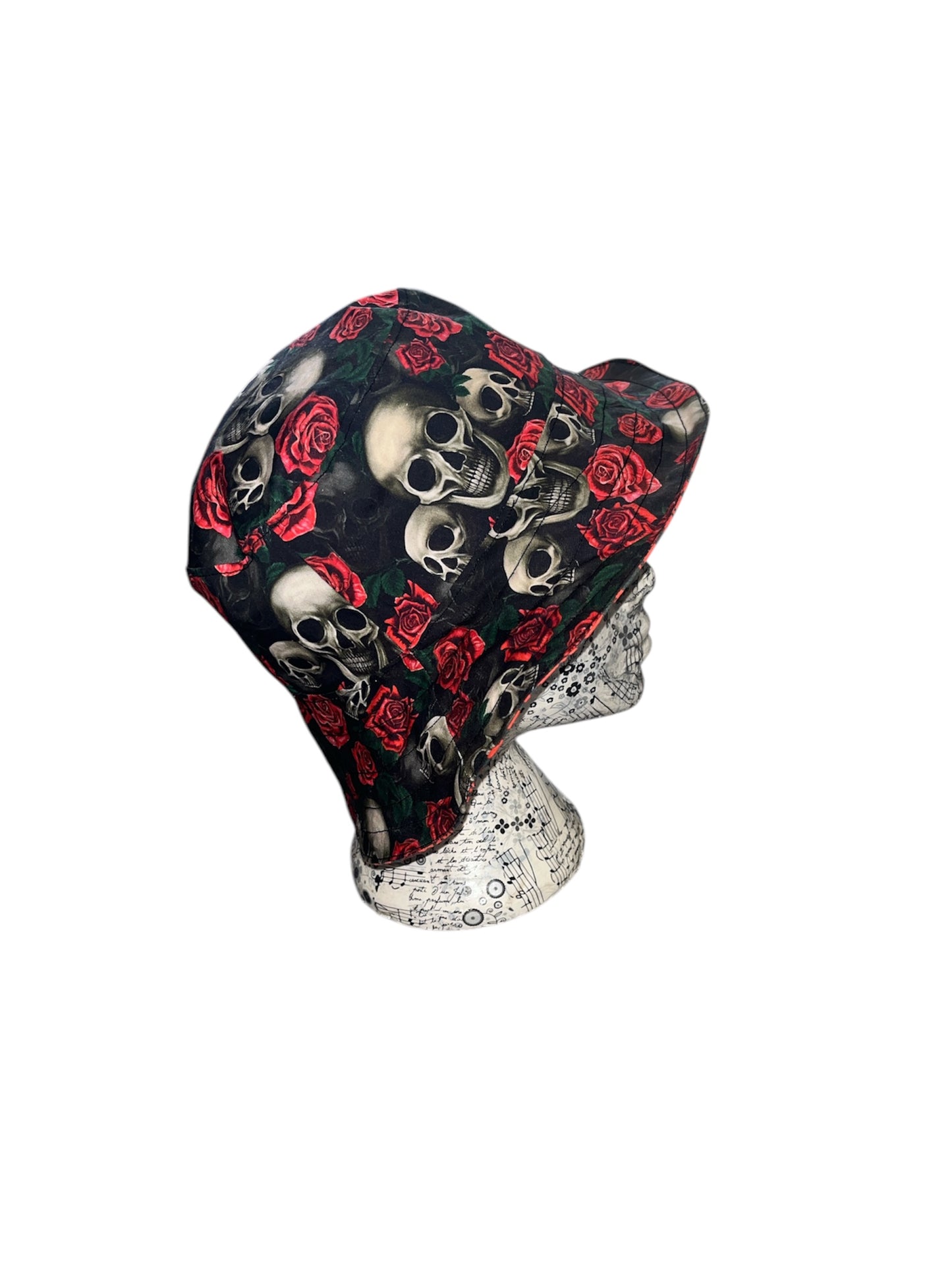 Reversible skull and rose/ crow and bat bucket hat