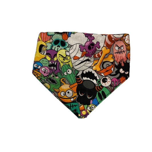 colourful cartoon monster fabric cat bandana. Bandana is triangular in shape